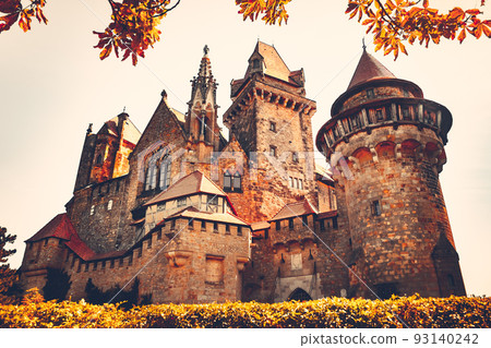 Beautiful medieval Kreuzenstein castle in Leobendorf village neat Vienna, Austria, Europe. Autumn season. Vintage retro filter. Orange toning 93140242
