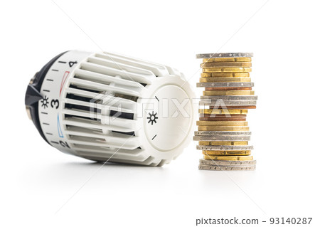 Thermostatic valve head with coins isolated on white background. 93140287