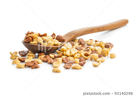 Breakfast cereal flakes in wooden spoon isolated on white background. 93140298