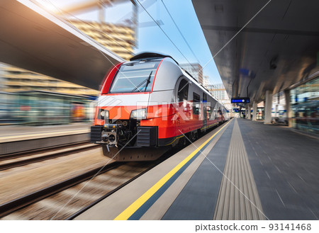 High speed train in motion on the railway station at sunset 93141468