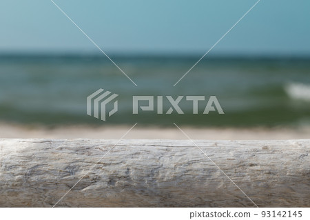 Mock-up for product presentation, wooden base and beach backdrop. Mock-up for product presentation, wooden base and beach backdrop. 93142145