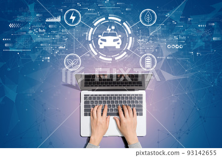 EV concept with person using laptop 93142655