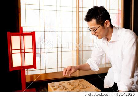 A man simulating a shogi match A man simulating a shogi match 93142929