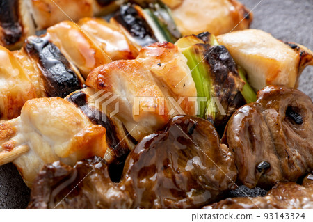 Close-up of assorted yakitori (tare-yaki) platter (negi and hearts). Close-up of assorted yakitori (tare-yaki) platter (negi and hearts). 93143324