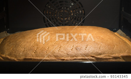 Pie in Oven. Homemade baking cake in the oven. Cooking process of delicious lemon tart. Pie in Oven. Homemade baking cake in the oven. Cooking process of delicious lemon tart. 93143345