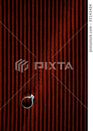 Wedding ring on red background Wedding ring on red background 93143484