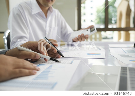 Asisan businessman teamwork meeting and discussing the investment data and report graph. Asisan businessman teamwork meeting and discussing the investment data and report graph. 93146743
