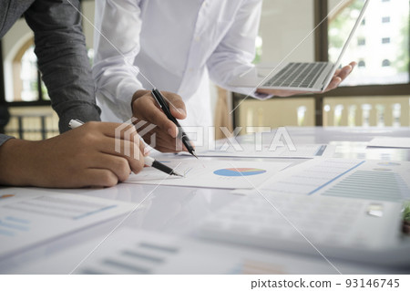 Asisan businessman teamwork meeting and discussing the investment data and report graph. Asisan businessman teamwork meeting and discussing the investment data and report graph. 93146745