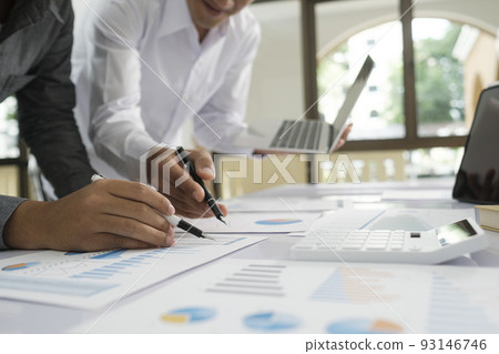 Asisan businessman teamwork meeting and discussing the investment data and report graph. 93146746