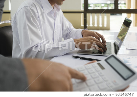 Close up asisan businessman teamwork meeting and discussing the investment data and report graph. 93146747