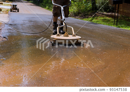 In action is a road flusher that is used for street washing, equipped with high pressure pumps and specialized heads that are used for street washing. In action is a road flusher that is used for street washing, equipped with high pressure pumps and specialized heads that are used for street washing. 93147538
