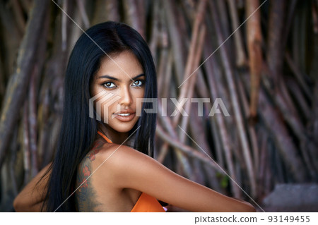 Close-up portrait of beautiful asian girl on a tree background 93149455