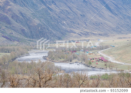 landscape of a village with houses and tourist bases next to a river 93152099