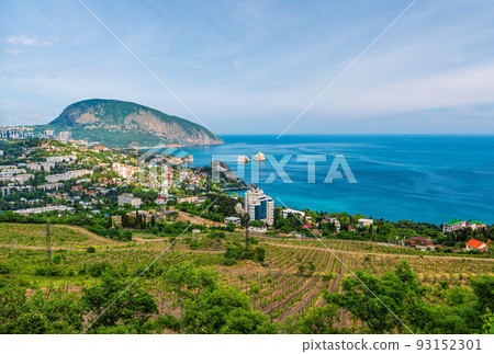 Panoramic view on resort city Gurzuf and Bear Mountain, Ayu-Dag, Yalta, Crimea. Sunny day. Copy space. The concept of an travel, relax, active and healthy life in harmony with nature. Panoramic view on resort city Gurzuf and Bear Mountain, Ayu-Dag, Yalta, Crimea. Sunny day. Copy space. The concept of an travel, relax, active and healthy life in harmony with nature. 93152301