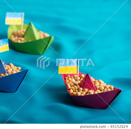Boats with Ukrainian soybeans made of paper origami concept Boats with Ukrainian soybeans made of paper origami concept 93152824