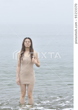 Shoot a portrait of a woman in her twenties on the coast of Otobe, Hokkaido in summer Shoot a portrait of a woman in her twenties on the coast of Otobe, Hokkaido in summer 93153370