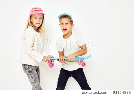 Modern teenagers posing together in caps with skateboard lifestyle childhood 93154886