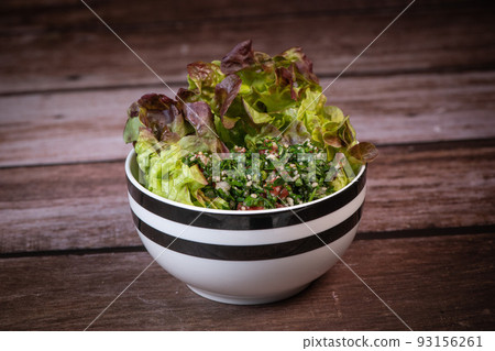 Parsley salad or Tabbouleh, easy and healthy classic vegetarian dish with bulgur, tomatoes, parsley Parsley salad or Tabbouleh, easy and healthy classic vegetarian dish with bulgur, tomatoes, parsley 93156261