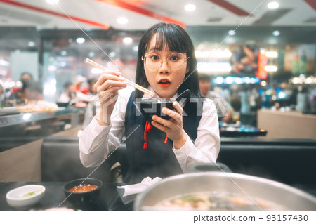 Happy young asian woman japanese thai student eating shabu japan sukiyaki restaurant. 93157430