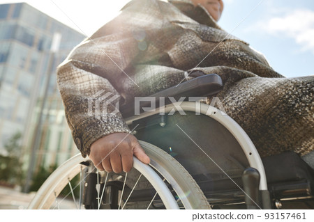 Woman in Wheelchair Closeup in City Setting 93157461