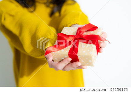 Woman in yellow knit present 93159173