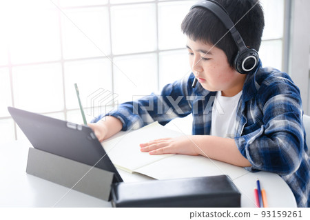 Boy teaching online class on tablet Boy teaching online class on tablet 93159261