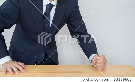 Businessman image that gets angry by hitting the fist Businessman image that gets angry by hitting the fist 93159605