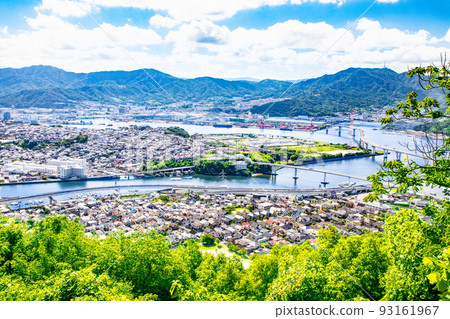 This is a distant view of the city in the eastern part of Hiroshima City. You can see Highway Route 2, Kaita Ohashi Bridge, Mazda exclusive bridge and factories. This is a distant view of the city in the eastern part of Hiroshima City. You can see Highway Route 2, Kaita Ohashi Bridge, Mazda exclusive bridge and factories. 93161967