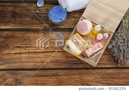 Natural handmade soap bars in box on wooden background, above view. Space for text Natural handmade soap bars in box on wooden background, above view. Space for text 93162250