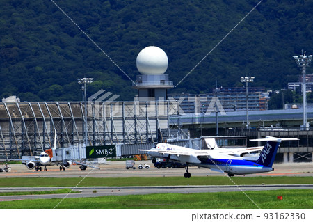 Osaka International Airport, a passenger plane taking off and landing Osaka International Airport, a passenger plane taking off and landing 93162330