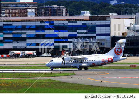 Osaka International Airport, a passenger plane taking off and landing 93162342