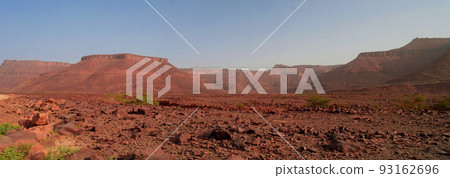 Panorama with Adrar mountain near Terjit, rocks and gorge in Mauritania Panorama with Adrar mountain near Terjit, rocks and gorge in Mauritania 93162696
