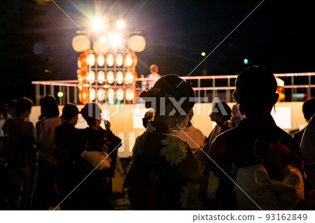 It is a snap scenery of Bon dance "Hiroshima Bon dance". A singer is singing on stage. Please use it as a background image of Obon. It is a snap scenery of Bon dance "Hiroshima Bon dance". A singer is singing on stage. Please use it as a background image of Obon. 93162849