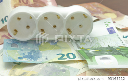 electric power strip and euro bancnotes. Increasing cost of electricity for business users and residential customers. Rise in electricity prices concept, horizontal 93163212