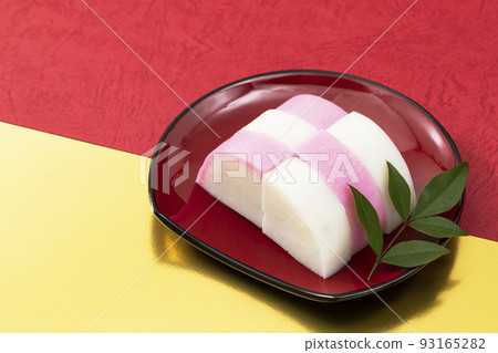 New Year dishes 7 _ red and white kamaboko on a red plate _ background red and gold 93165282