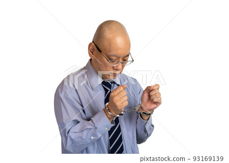 handcuffed businessman handcuffed businessman 93169139