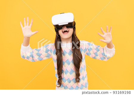 happy teen girl wear vr glasses using future technology for education in virtual reality, innovation 93169198