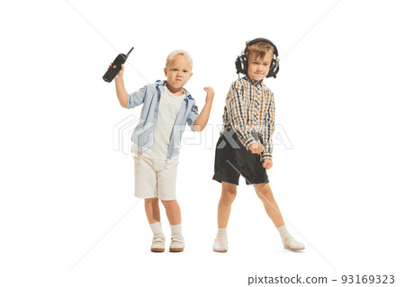 Portrait of little boys, children playing together in spies, having fun, posing isolated over white studio background Portrait of little boys, children playing together in spies, having fun, posing isolated over white studio background 93169323