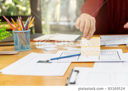 UX UI Concept, Graphic designers work together with UX UI designer planning application template layout framework for mobile phone computer mobile 93169524