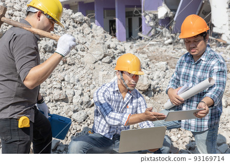 Engineer architect and worker operation control demolish old building. Engineer architect and worker operation control demolish old building. 93169714