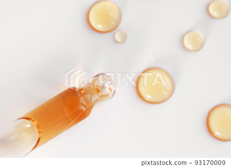 Pipette with fluid serum, oil, face gel cleaner. Cosmetics and healthcare concept closeup. Dose of retinol with air bubbles. Flat lay. Monkeypox, coronavirus research Pipette with fluid serum, oil, face gel cleaner. Cosmetics and healthcare concept closeup. Dose of retinol with air bubbles. Flat lay. Monkeypox, coronavirus research 93170009