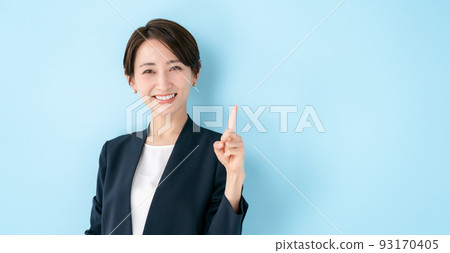 Business woman pointing blue back Business woman pointing blue back 93170405