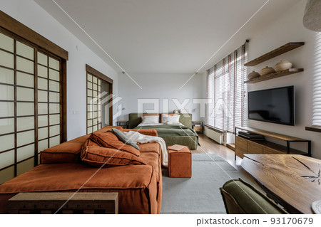 Modern Japandi interior design appartment in earth tones, natural textures with wooden solid oak furniture and sliding Japanese wood doors. Japandi concept Modern Japandi interior design appartment in earth tones, natural textures with wooden solid oak furniture and sliding Japanese wood doors. Japandi concept 93170679