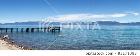 Dock on the Lake surrounded by Mountains. Summer Season. Dock on the Lake surrounded by Mountains. Summer Season. 93171388