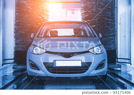 Car washing automatic carwash. Brush washer clean blue auto car on automatic car wash station. Carwash cleaning service. 93171406