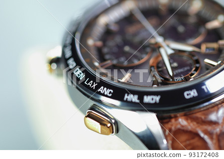 close up shallow focus Time zone cities code on luxury world time watch bezel on LAX Los Angeles. 93172408