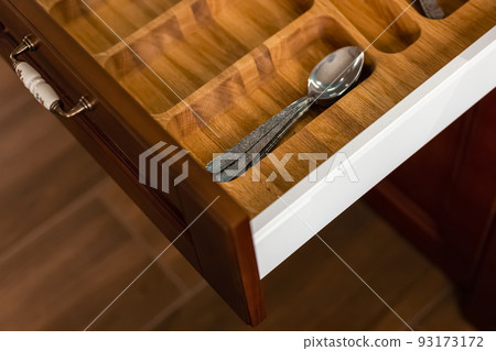 Set of cutlery trays in kitchen drawer. Set of cutlery trays in kitchen drawer. 93173172