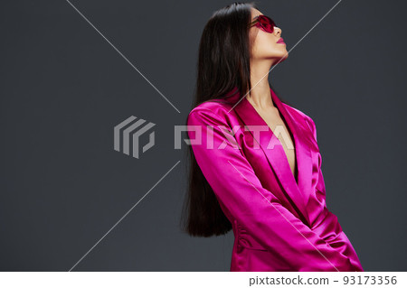 young woman in a pink mini dress fashion glasses luxury isolated background 93173356