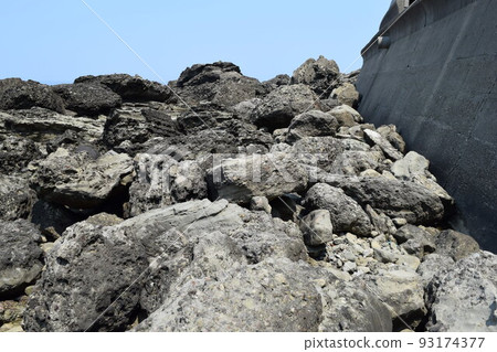 The rocky landscape of the Shonai coast where rocky shores of strangely shaped rocks continue 93174377