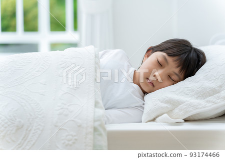 girl taking a nap in the bedroom 93174466